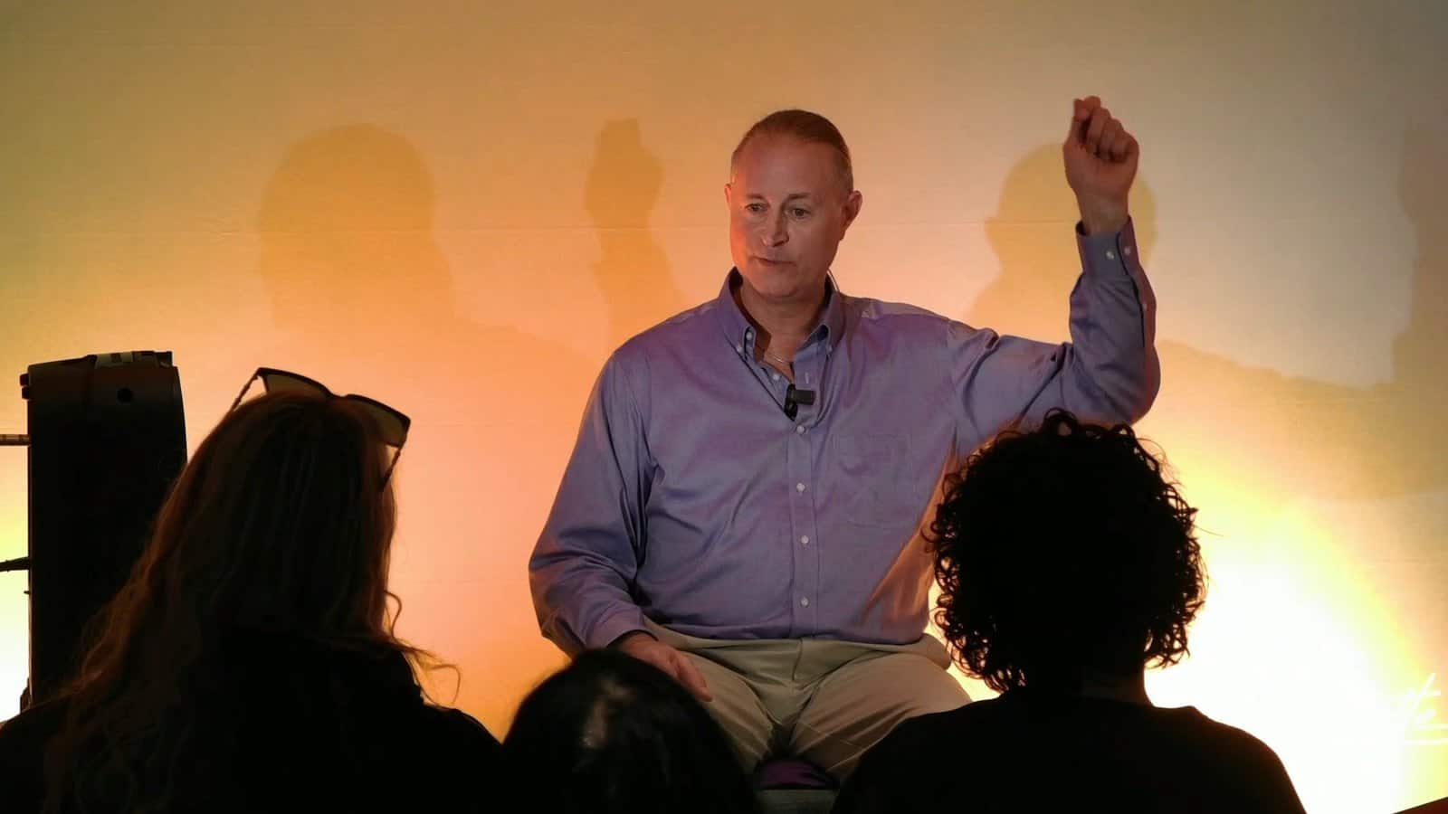 Pascal N. Paquette speaking, fist raised