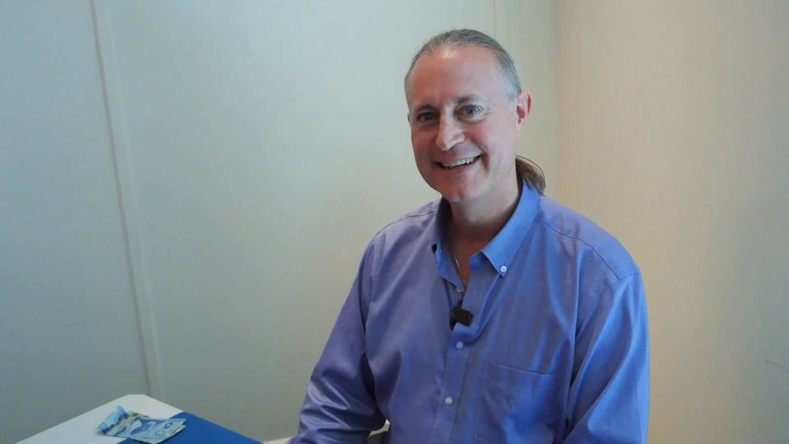 Pascal N. Paquette at his book-signing table, with a broad smile
